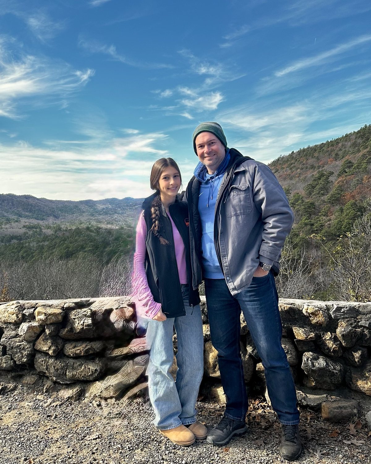 Simão and his daughter Lara, hosts of Arborium Cabins, at an overlook in the Ouachita Mountains