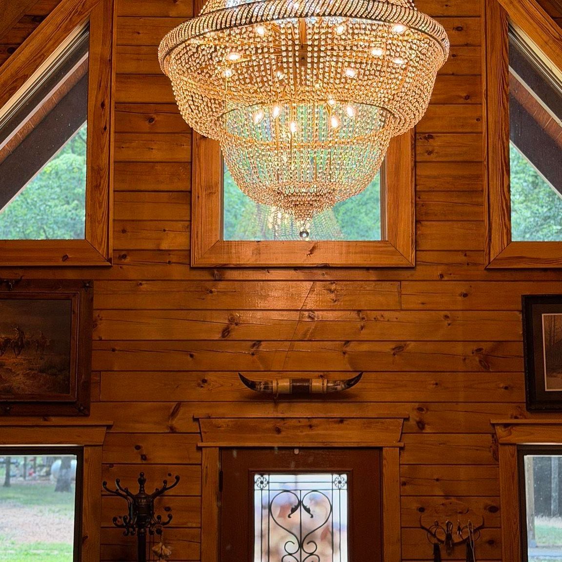 Crystal chandelier under the gable windows of the great room