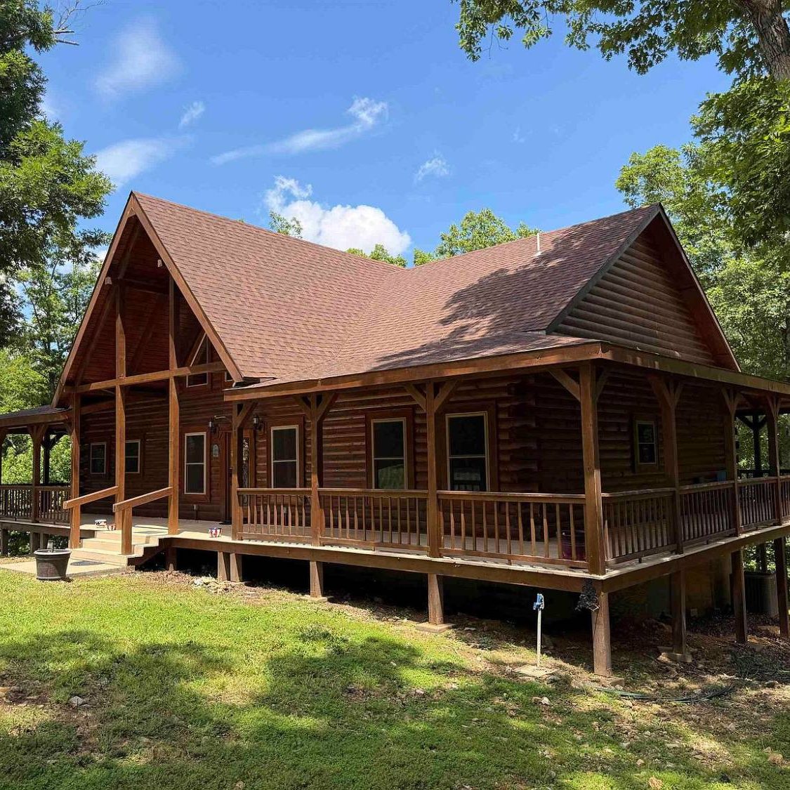 Sugar Creek Cabin exterior under the white oak canopy